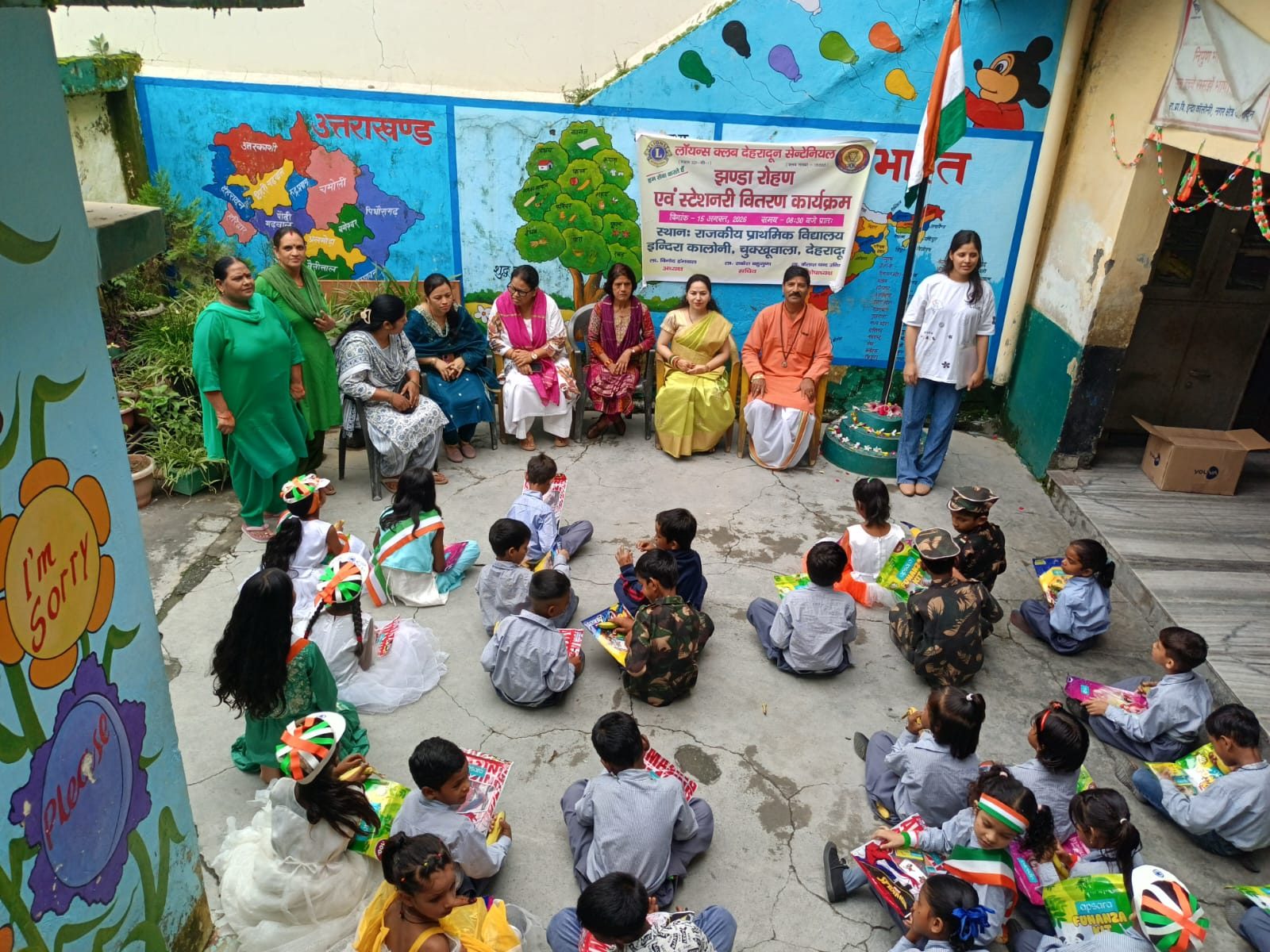 Community gathering with children and local representatives